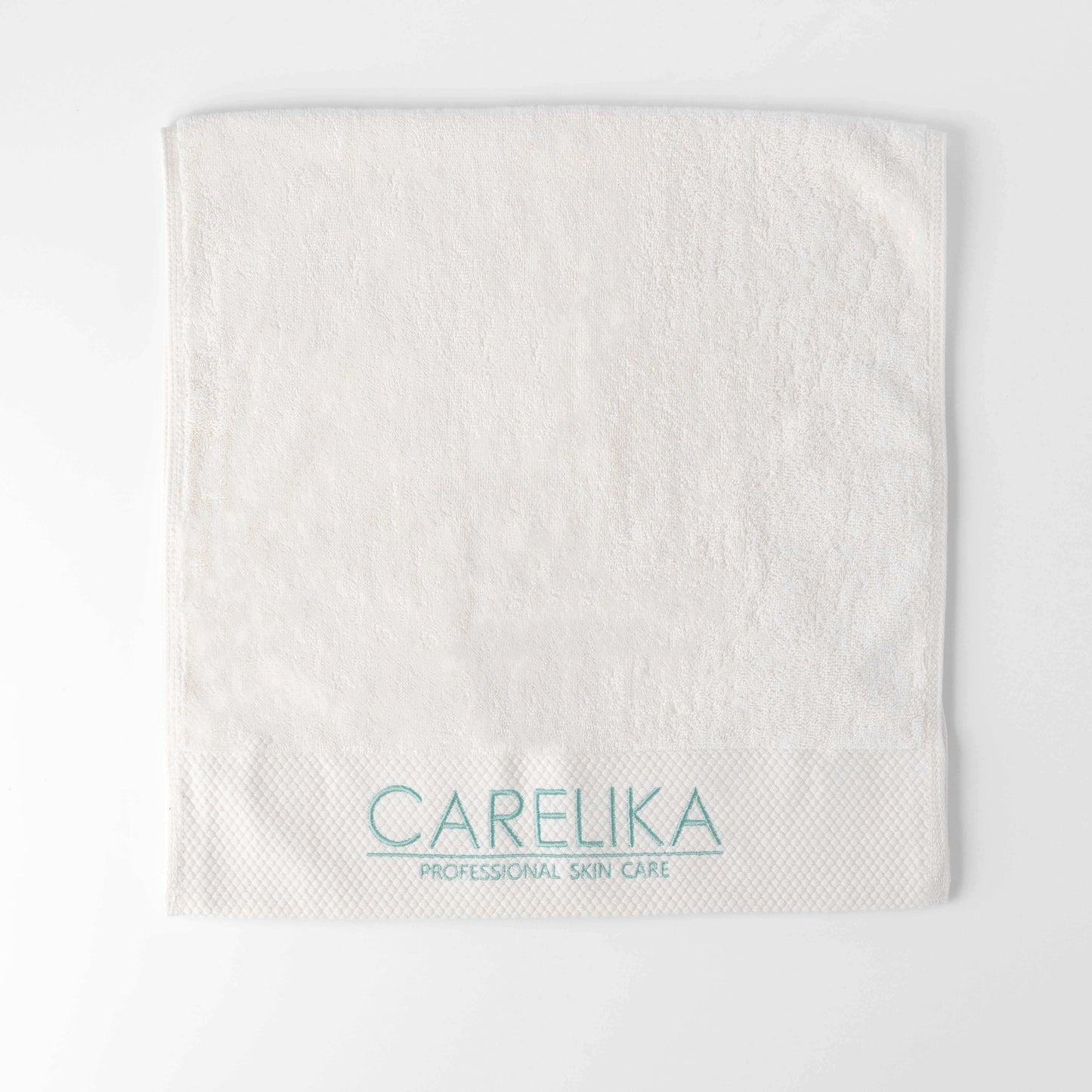 Carelika hand towel 40x80cm in white, made from 100% cotton, featuring embroidered logo for luxury and absorbency.