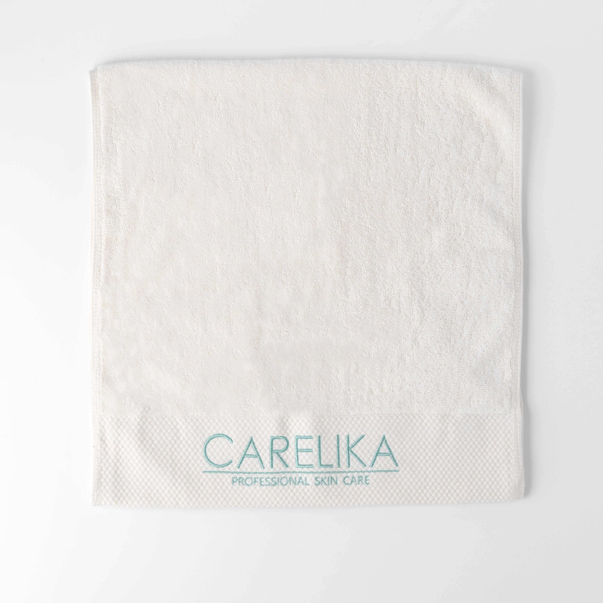 Carelika hand towel 40x80cm in white, made from 100% cotton, featuring embroidered logo for luxury and absorbency.