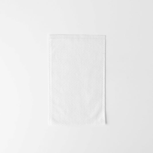 White disposable soft washing mitten for gentle facial cleansing and comfort in cosmetologic procedures.